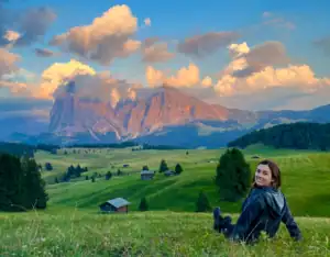 Relaxing on the Dolomites alpine meadow (Alpe di Suisi) while the sun was setting. 