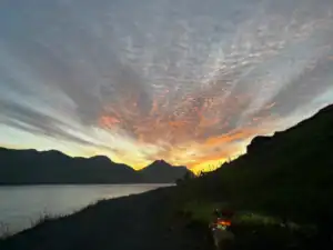 An amazing midnight-sun sunset while driving in the Faroe Islands. The moment we popped both tires on the rental car, oops!