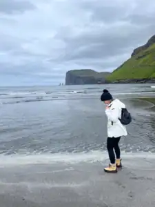 Me walking along the ocean at Tjornuvik beach.