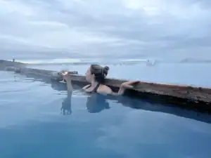 Sipping a wine while soaking in the Myvatn hot spring.
