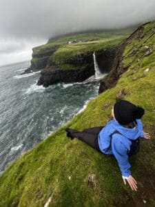 Me sitting and looking at the amazing Mulafossur waterfall.