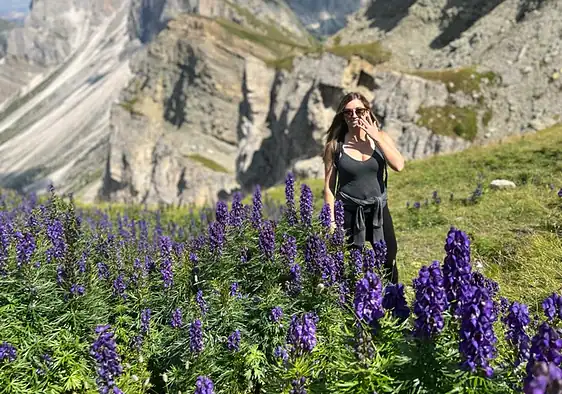 Standing in the purple flowers with the Seceda Ridgeline, Dolomites.