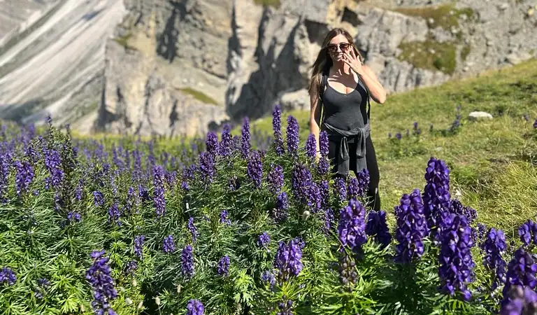 Standing in the purple flowers with the Seceda Ridgeline, Dolomites.