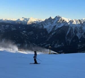 Skiing down the wide-open terrain at Kronplatz ski resort.