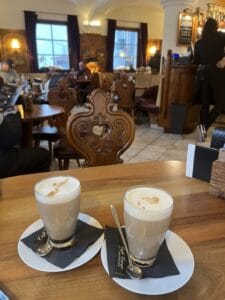 Drinking warm coffees at Cafe Corso in Ortisei, Dolomites. 
