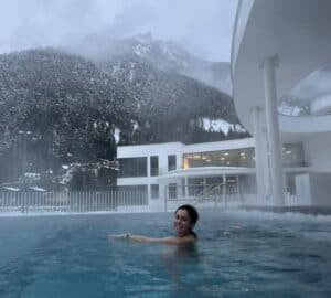 Soaking in the heated pool while snow falls at Atoll Achensee in Austria.