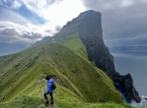 Me hiking Kallur lighthouse hike with its dramatic cliffs and ocean views.