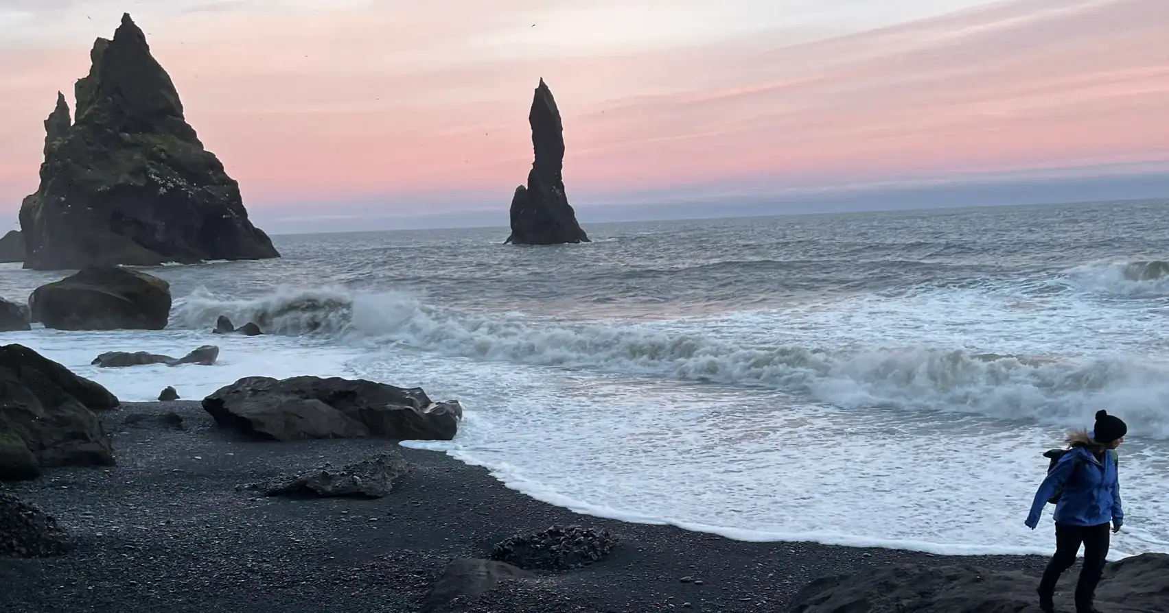 Walking along the shore of Reynisfjara (black sand beach) during the midnight sun.