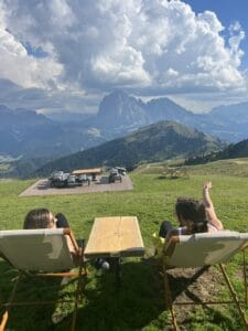 Relaxing in the lawn chairs admiring the mountain views at the top of Seceda. 